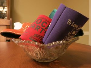 A collection of koozies on koozie guy's table